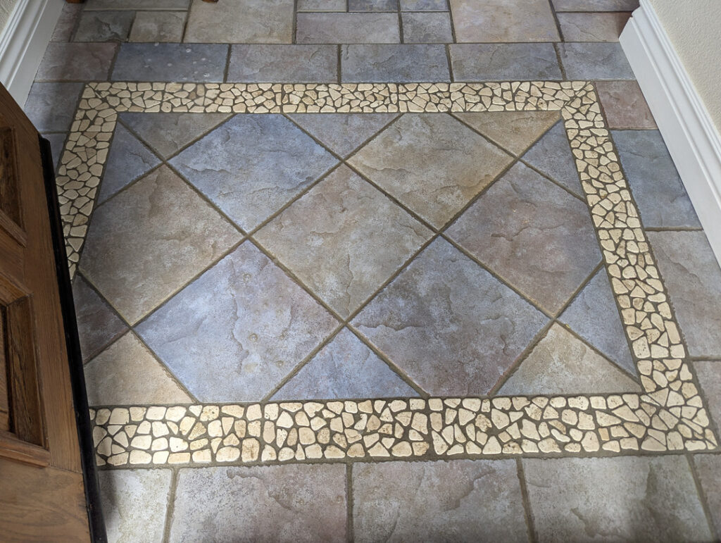 cleaning service on a patterned tile floor with grout borders showing attention to detail and cleanliness
