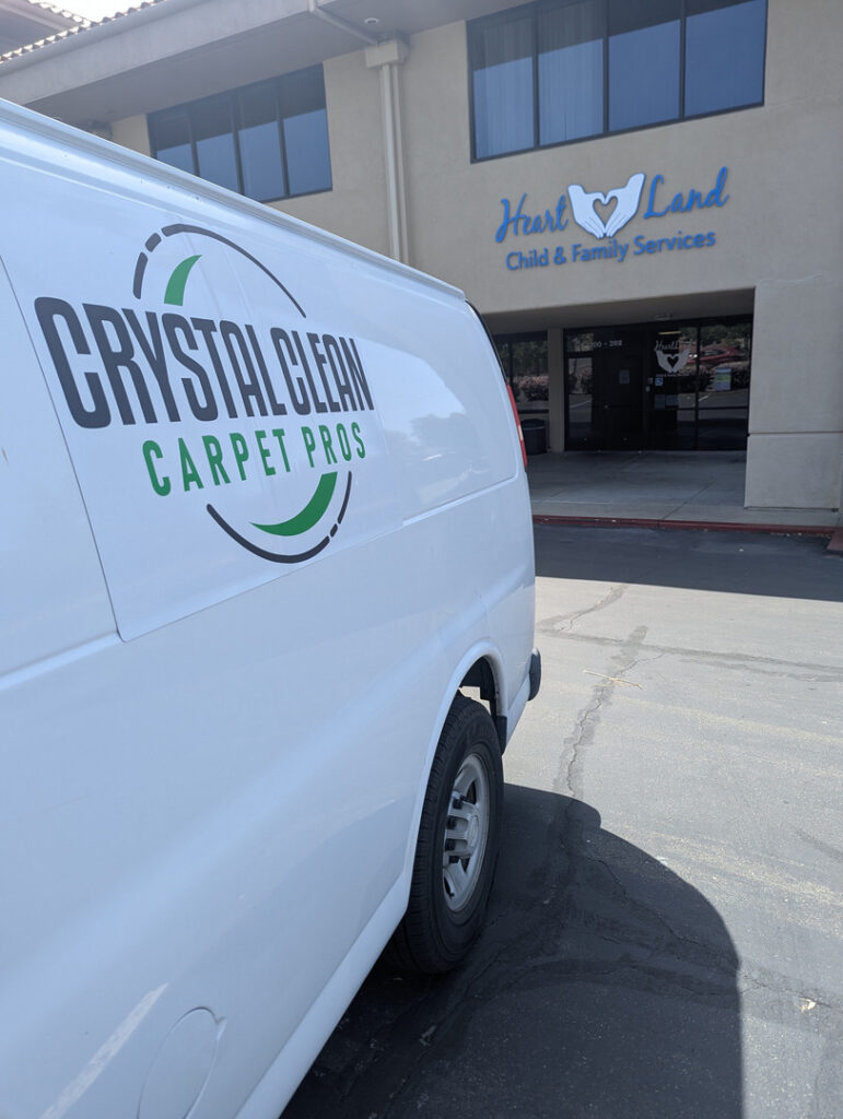 crystal clean carpet pros vehicle parked outside a building likely preparing for carpet cleaning services